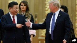U.S. President Donald Trump China's President Xi Jinping arrive for the state dinner with the first ladies at the Great Hall of the People in Beijing, China, Nov. 9, 2017.