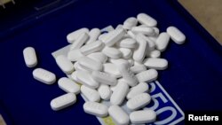 FILE - Tablets of the opioid-based Hydrocodone are seen at a pharmacy in Portsmouth, Ohio, June 21, 2017. 