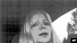 FILE - In this undated file photo provided by the U.S. Army, Pfc. Chelsea Manning poses for a photo wearing a wig and lipstick. Attorneys for the transgender soldier imprisoned in Kansas for sending classified information to the anti-secrecy website WikiLeaks said Monday, July 11, 2016, her hospitalization last week was due to an attempted suicide.