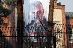 A picture of Iranian Major General Qassem Soleimani, head of the elite Quds Force, who was killed in an airstrike at Baghdad airport, is seen on the former U.S. Embassy's building in Tehran, Iran, Jan. 7, 2020.