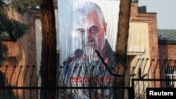 A picture of Iranian Major General Qassem Soleimani, head of the elite Quds Force, who was killed in an airstrike at Baghdad airport, is seen on the former U.S. Embassy's building in Tehran, Iran, Jan. 7, 2020.