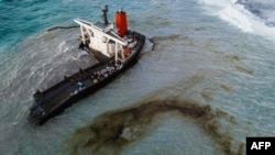 This aerial picture taken on Aug. 16, 2020, shows the MV Wakashio bulk carrier that had run aground and broke into two parts near Blue Bay Marine Park, Mauritius.