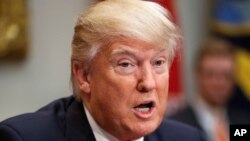 FILE - President Donald Trump speaks during his meeting with House and Senate legislators in the Roosevelt Room of the White House in Washington.