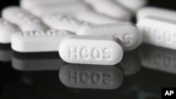 FILE - An arrangement of hydroxychloroquine pills is seen in Las Vegas, Nevada, April 6, 2020. 