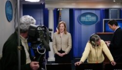 FILE - White House Deputy Communications Director Jen Psaki is interviewed in the James Brady Press Briefing Room at the White House, Feb. 16, 2011.
