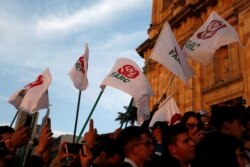 Revolutionary Alternative Force of the Common (FARC) Political party flags are seen during a protest in support of the Special Jurisdiction for Peace (JEP) in Bogota, Colombia, March 13, 2019.