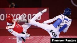 ناهید کیانی، چپ، و سایر جودوکاران ایرانی بدون کسب مدال بازی های توکیو را ترک کردند. ارشیو