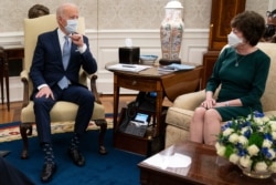 President Joe Biden meets with Sen. Susan Collins, R-Maine, to discuss a coronavirus relief package, in the Oval Office of the White House, Feb. 1, 2021, in Washington.