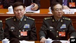 In this March 8, 2017, photo, Zhang Yang, left, the then-head of China's People's Liberation Army (PLA) political affairs department, is seen with Fang Fenghui, right, the then-chief of the general staff of the Chinese People's Liberation Army.
