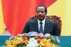 FILE - President of Cameroon Paul Biya with Chinese President Xi Jinping (not pictured) attend a signing ceremony at The Great Hall Of The People in Beijing, China, March 22, 2018.