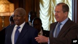 FILE - Russian Foreign Minister Sergey Lavrov, right, welcomes Ugandan counterpart Sam Kutesa, Moscow, May 12, 2014.