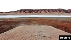 FILE - A boat ramp leads to the drought-affected Split Rock Dam near Tamworth in rural Australia, Sept. 23, 2019. 