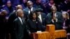 Flanked by the Rev. Al Sharpton and her husband, Rodney Wells, RowVaughn Wells speaks during the funeral service for her son Tyre Nichols at Mississippi Boulevard Christian Church in Memphis, Tenn., Feb. 1, 2023. 