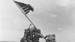 Joe Rosenthal's 1945 photograph of the US Marines of the 28th Regiment of the Fifth Division raising the American flag on Mount Suribachi, Iwo Jima
