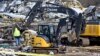 Emergency response workers dig through the rubble of the Mayfield Consumer Products candle factory in Mayfield, Kentucky, Dec. 11, 2021, after it was destroyed by a tornado.