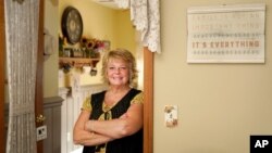 Kay Orzechowicz poses Wednesday, Sept. 2, 2020, for a portrait at her Griffith, Ind., home. After 35 years of teaching, Orzechowicz said COVID-19 "pushed her over the edge" to retire from northwest Indiana's Griffith High School at the end of July…