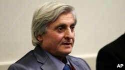 FILE - Syrian refugee Refaai Hamo addresses the media during a news conference, in Romulus, Mich.