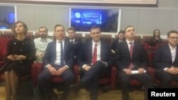 Russian opposition leader Alexei Navalny, who submitted his documents to be registered as a presidential candidate, attends a meeting at the Central Election Commission in Moscow, Dec. 25, 2017.