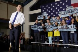 FILE - Democratic presidential candidate former South Bend, Ind. Mayor Pete Buttigieg reacts at a campaign event in Exeter, N.H., Feb. 10, 2020.