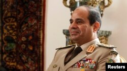 FILE - Egypt's Army Chief General Abdel Fattah al-Sisi at El-Thadiya presidential palace in Cairo, Nov. 14, 2013