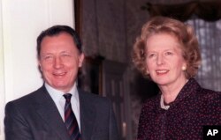FILE - Jacques Delors of France, president of the European Commission, meets British Prime Minister Margaret Thatcher for talks at 10 Downing Street, London, on Nov. 26, 1986.