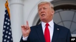 President Donald Trump speaks to reporters at Trump National Golf Club in Bedminster, New Jersey, Aug. 10, 2017. 