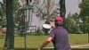 In the game of disc golf, players try to land their Frisbee-like discs in a raised metal basket.