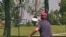 In the game of disc golf, players try to land their Frisbee-like discs in a raised metal basket.