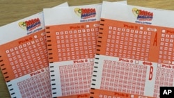 Mega Millions bet cards are shown at the Corner Market, Oct. 17, 2018, in Lyndhurst, Ohio.