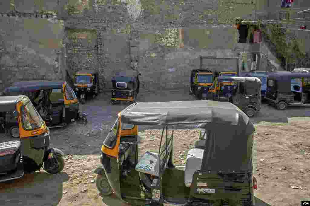 Toktoks are parked in a local garage in old Cairo. Unlicensed toktoks that does not hold identification plates, turns to an easy subject for stealing. (H. Elrasam/VOA)