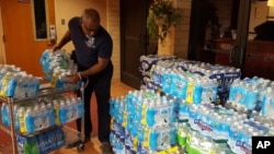 Water is donated to Flint, Michigan, for residents unable to drink water from their pipes.