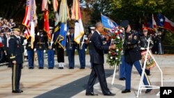 President Barack Obama lays a wreath at the Tomb of the Unknowns, on Veterans Day, Nov. 11, 2016, at Arlington National Cemetery in Arlington, Va.