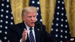 President Donald Trump answers questions from reporters in the East Room of the White House, April 30, 2020, in Washington, D.C.