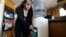 In a Dec. 9, 2010 photo, Roberta Walker draws bottled water at her home in Hinkley, California. The small community's struggles with contaminated groundwater inspired the award-winning Hollywood movie "Erin Brockovich."