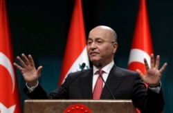 Iraq's President Barham Salih speaks to the media during a joint news conference with Turkey's President Recep Tayyip Erdogan, in Ankara, Turkey, Jan. 3, 2019.