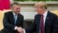 President Donald Trump shakes hands with Slovak Prime Minister Peter Pellegrini during a meeting in the Oval Office of the White House, May 3, 2019, in Washington.