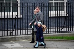 Richard Ratcliffe, the husband of Nazanin Zaghari Ratcliffe, his daughter Gabriella and his mother arrive at Downing Street in London, Jan. 23, 2020.