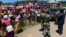 People in Chimanimani complain, March 22, 2019, to senior army officials in charge of a temporary camp set up after Cyclone Idai that food is not reaching them.