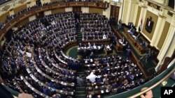 FILE - Members of Egypt's Parliament attend the inaugural session, the first to convene in three years, in Cairo.