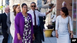 FILE - After commuting the sentences of several dozen drug offenders, President Barack Obama meets with former inmates to learn about re-entry challenges, at a restaurant in Washington, D.C., March 30, 2016.