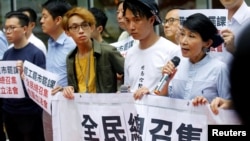 Pro-democracy legislator Claudia Mo speaks during a protest outside the Legislative Council building in Hong Kong, June 11, 2019. 