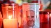 Candles are lit at the statue of John Paul II outside the Gemelli University Hospital where Pope Francis is hospitalized with pneumonia, in Rome on March 04, 2025.