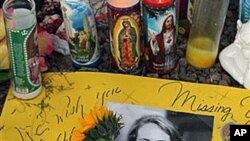 A poster outside of Rep. Gabrielle Giffords office in Tucson, Ariz., wishes her well, Jan 16, 2011