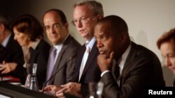 Google Executive Chairman Eric Schmidt, center, joins panelists hearing privacy and public information concerns in Madrid Sept. 9, 2014.