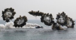 FILE - South Korean amphibious assault vehicles participate in a 2015 U.S.-South Korea joint military exercise.