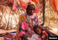 Hanan Idriss, a 22-year-old mother of two, speaks in the border town of Adre, Chad, Nov. 14, 2023. Idriss said RSF and Arab militiamen attacked her house in Ardamata, West Darfur, and tried to sexually assault her and her sister.