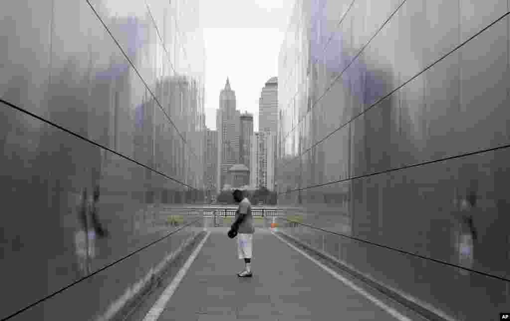Barry Hogan prays at the Empty Sky Memorial at Liberty State Park, Sept. 11, 2014, in Jersey City, New Jersey. 