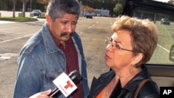 Sandra Zea speaks to reporters outside the U.S. District Courthouse in Central Islip, N.Y., following the arraignment of hers son Marcos Alonzo Zea, Oct. 18, 2013.