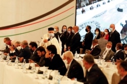 FILE - Participants attend the Libyan Political Dialogue Forum in Tunis, Tunisia, Nov. 9, 2020.