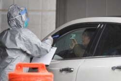A patient arrives to be tested for the coronavirus at Glen Island Park, March 13, 2020, in New Rochelle, New York.